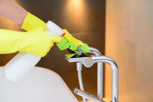 Carpet cleaning technician preparing safe equipment in a domestic property