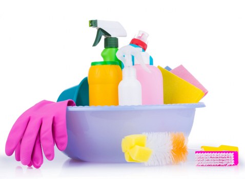 Domestic cleaner working in a central London apartment kitchen in W1G