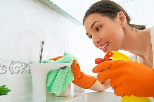 Cleaner working in a W1G apartment with careful attention to local property details